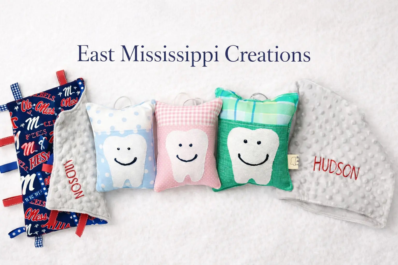 East Mississippi Creations logo for personalized embroidered baby gifts and sewn goods