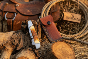 Razor Trapper Knife with Burned Bone Handle and Steel Bolsters detail view by JW SteelCrafts
