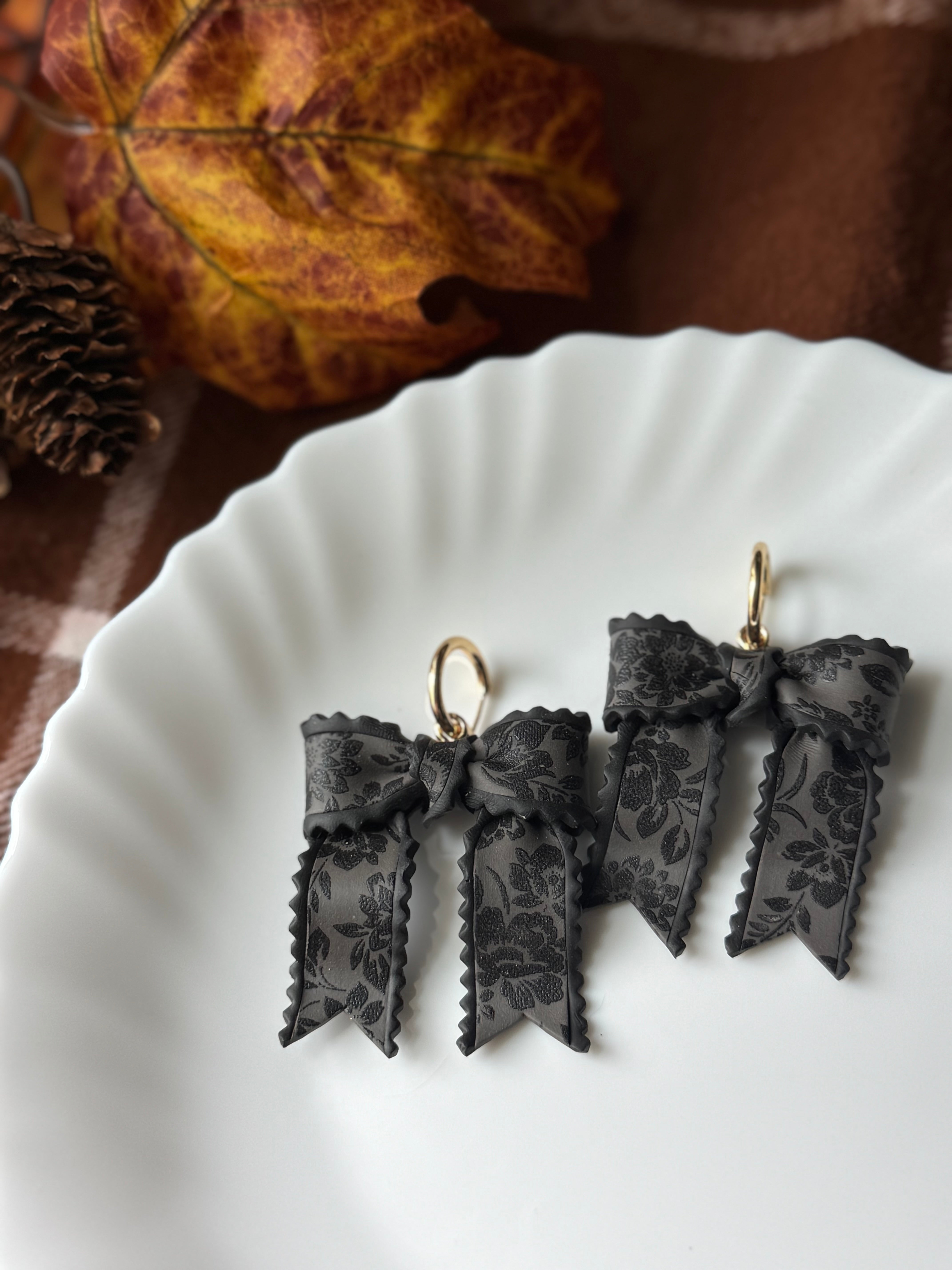 Black Lace Bows handmade polymer clay earrings by Shop Something Earthy — view 1 of 2