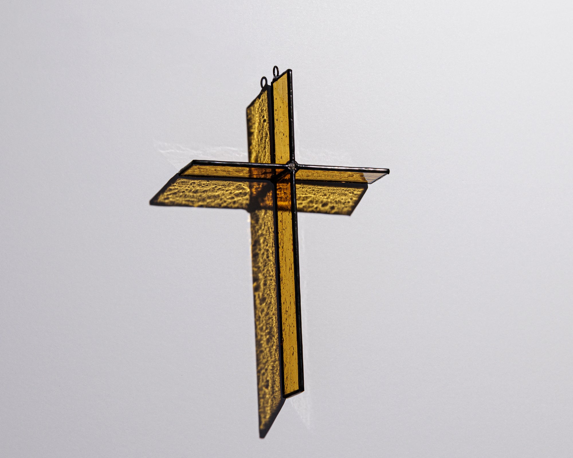 Alternate view of Classic Amber Cross Suncatcher with real stained glass and black patina
