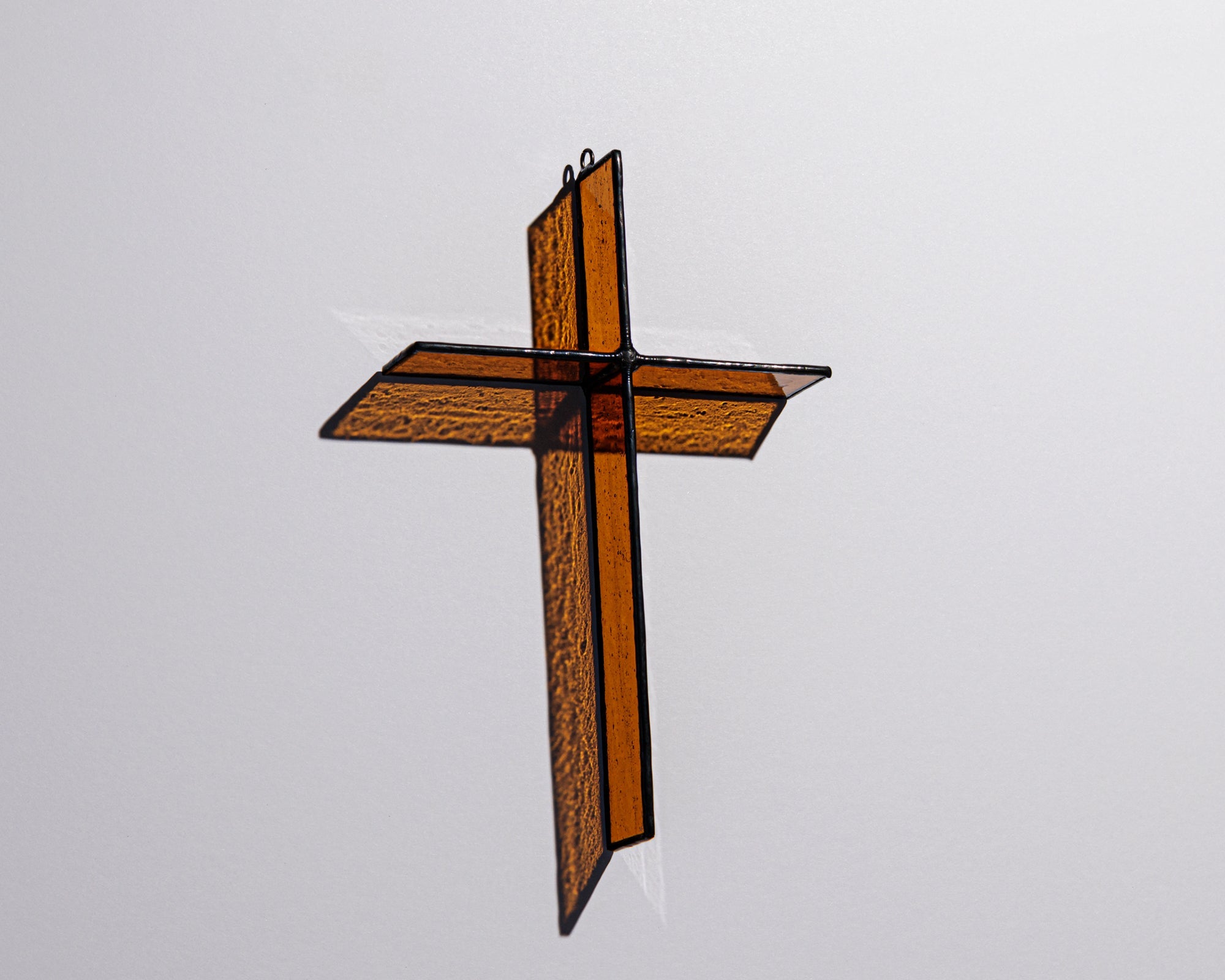 Alternate view of Burnt Amber Cross Suncatcher with real stained glass and black patina