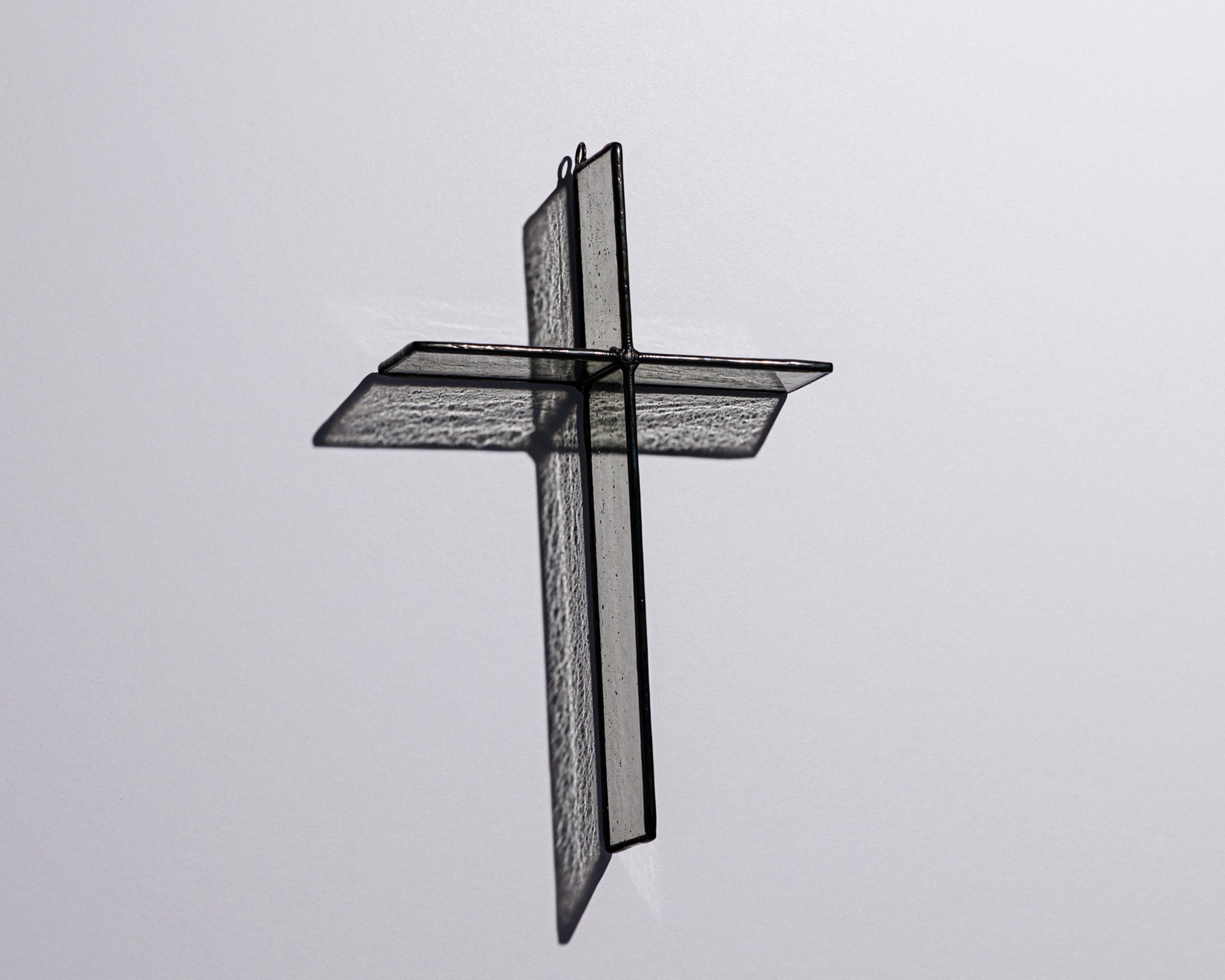 Alternate view of Cloud Grey Cross Suncatcher with real stained glass and black patina