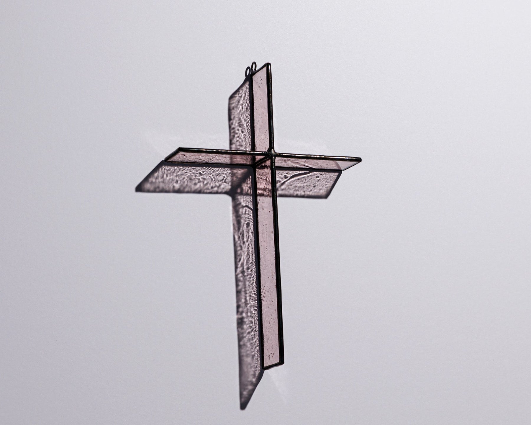 Alternate view of Rose Mist Cross Suncatcher with real stained glass and black patina