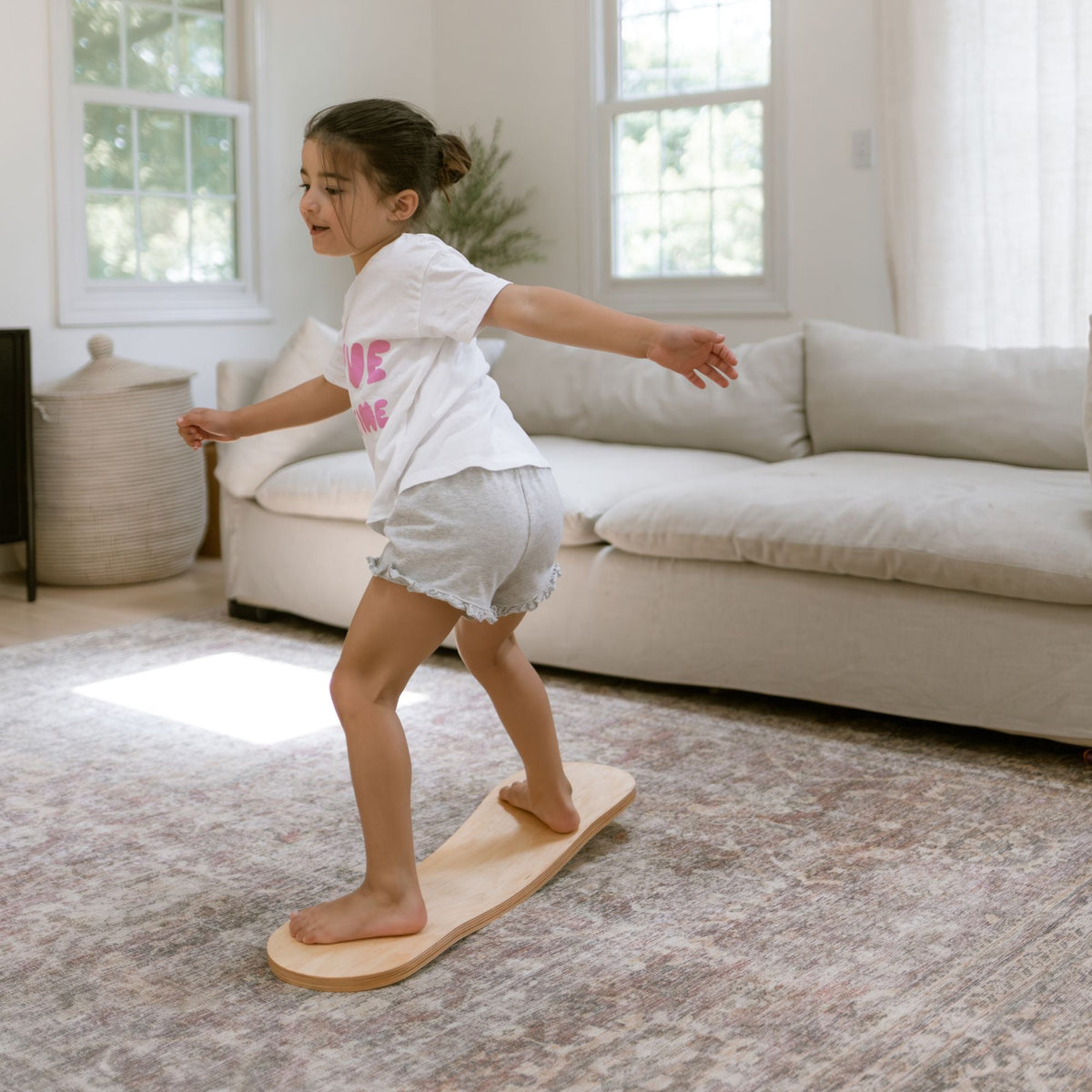 Spinzee Board by Bunny Hopkins, handcrafted wooden activity toy product and lifestyle photo 13