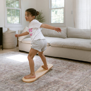 Spinzee Board by Bunny Hopkins, handcrafted wooden activity toy product and lifestyle photo 13