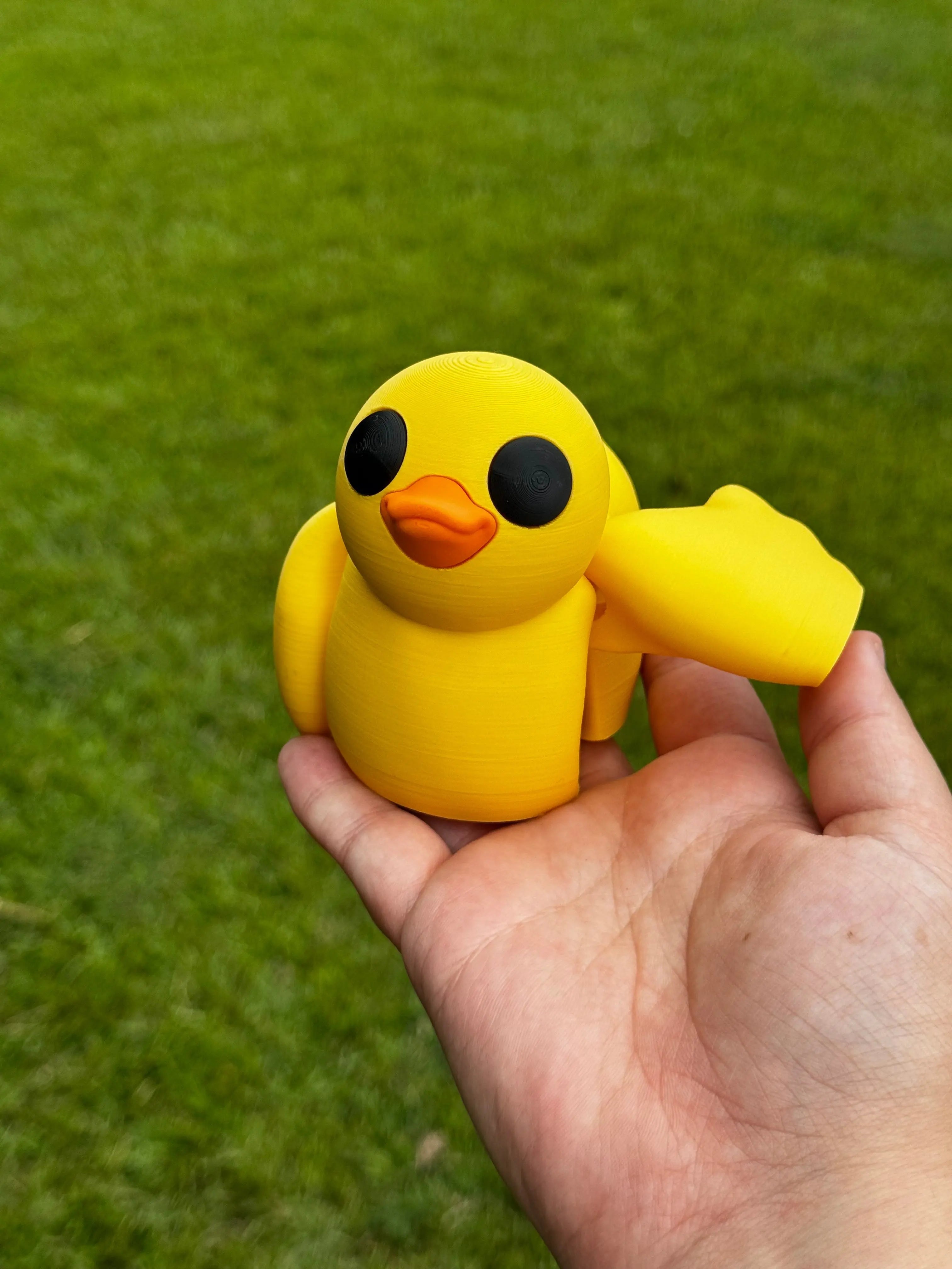 3D Printed Yellow Duck Fidget Toy Held in Hand - Stress Relief Desk Decor