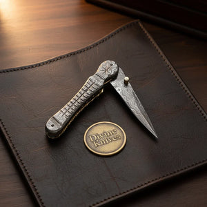Engraved Damascus Liner-Lock Dagger Folder - Old-World Steel in Your Pocket