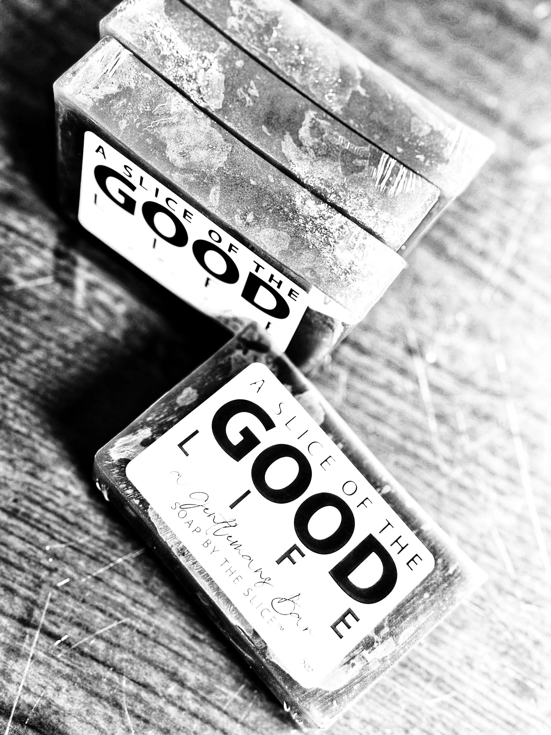 Black and white image of A Gentleman's Bar Soap bars with "A Slice of the Good Life" label.