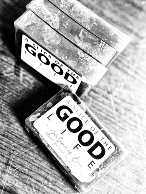 Black and white image of A Gentleman's Bar Soap bars with "A Slice of the Good Life" label.
