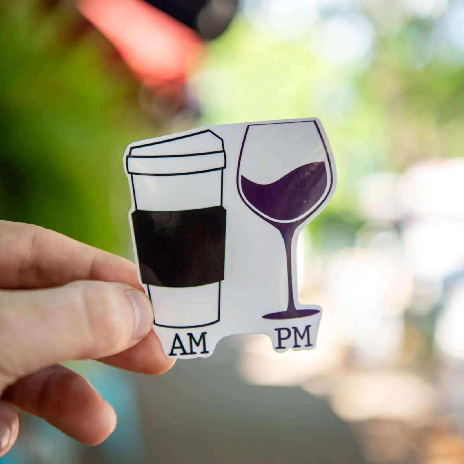 Vinyl sticker with a coffee cup labeled AM and a wine glass labeled PM.