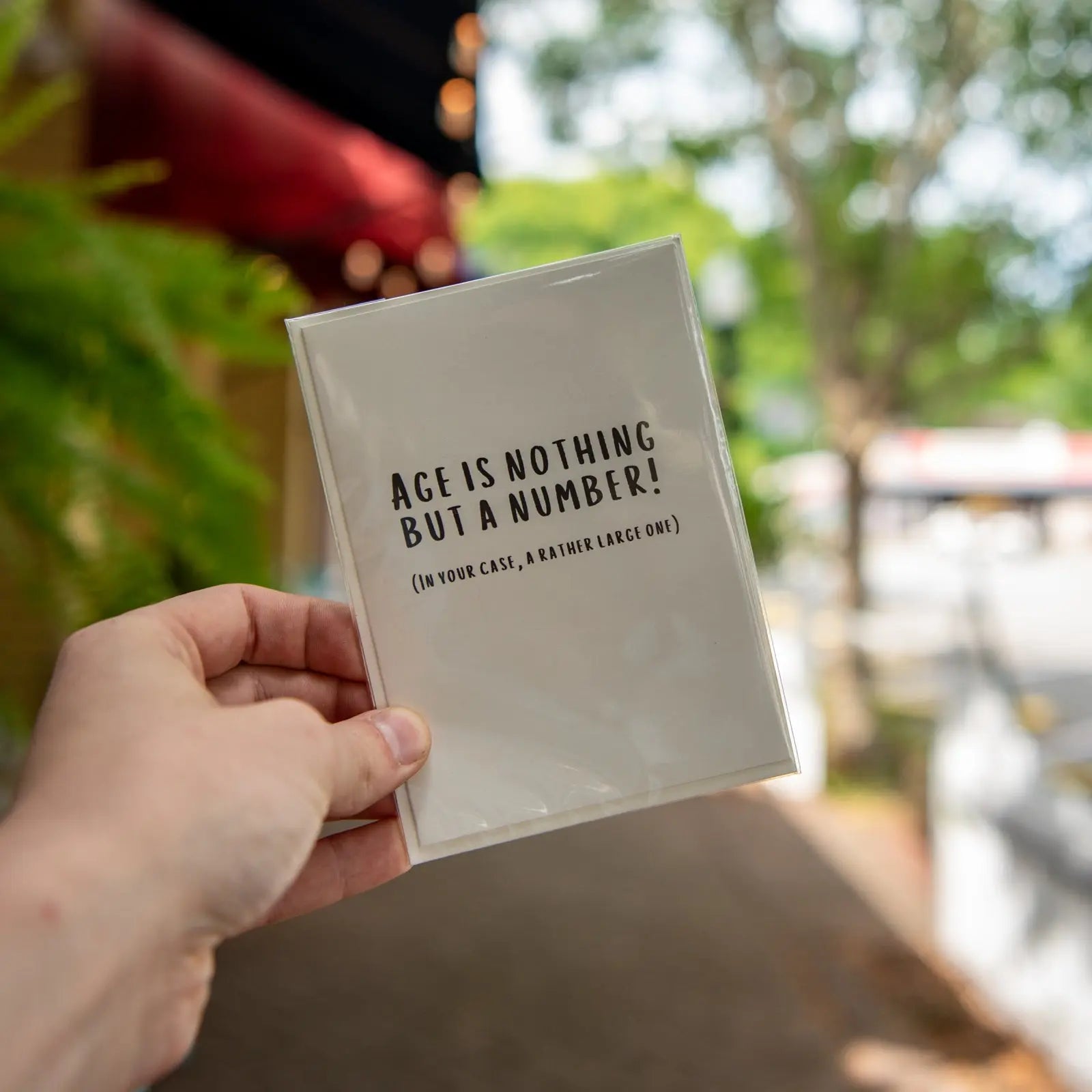 White card with black text "Age is nothing but a number!"