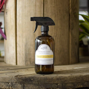 Amber glass All-Purpose Cleaner spray bottle with Sweet Citrus Burst label from Still Magnolia.