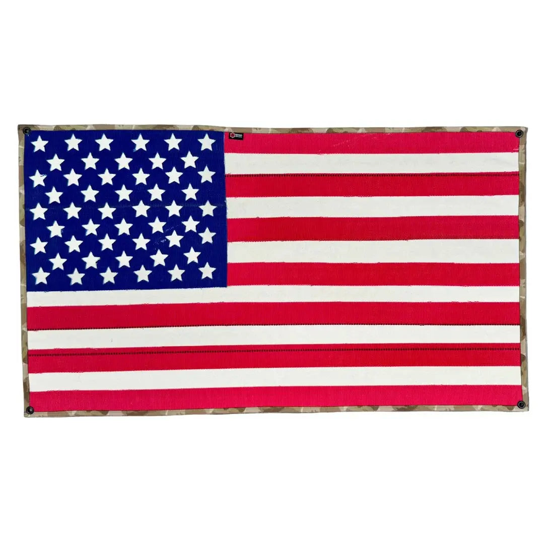 American flag made from red fire hose with blue star field and arid border.