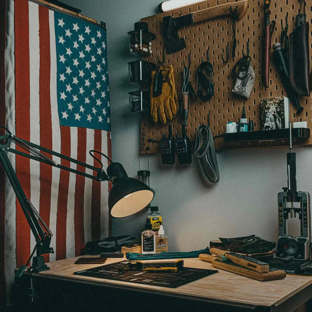 American flag made from fire hose displayed on a desk with tools.