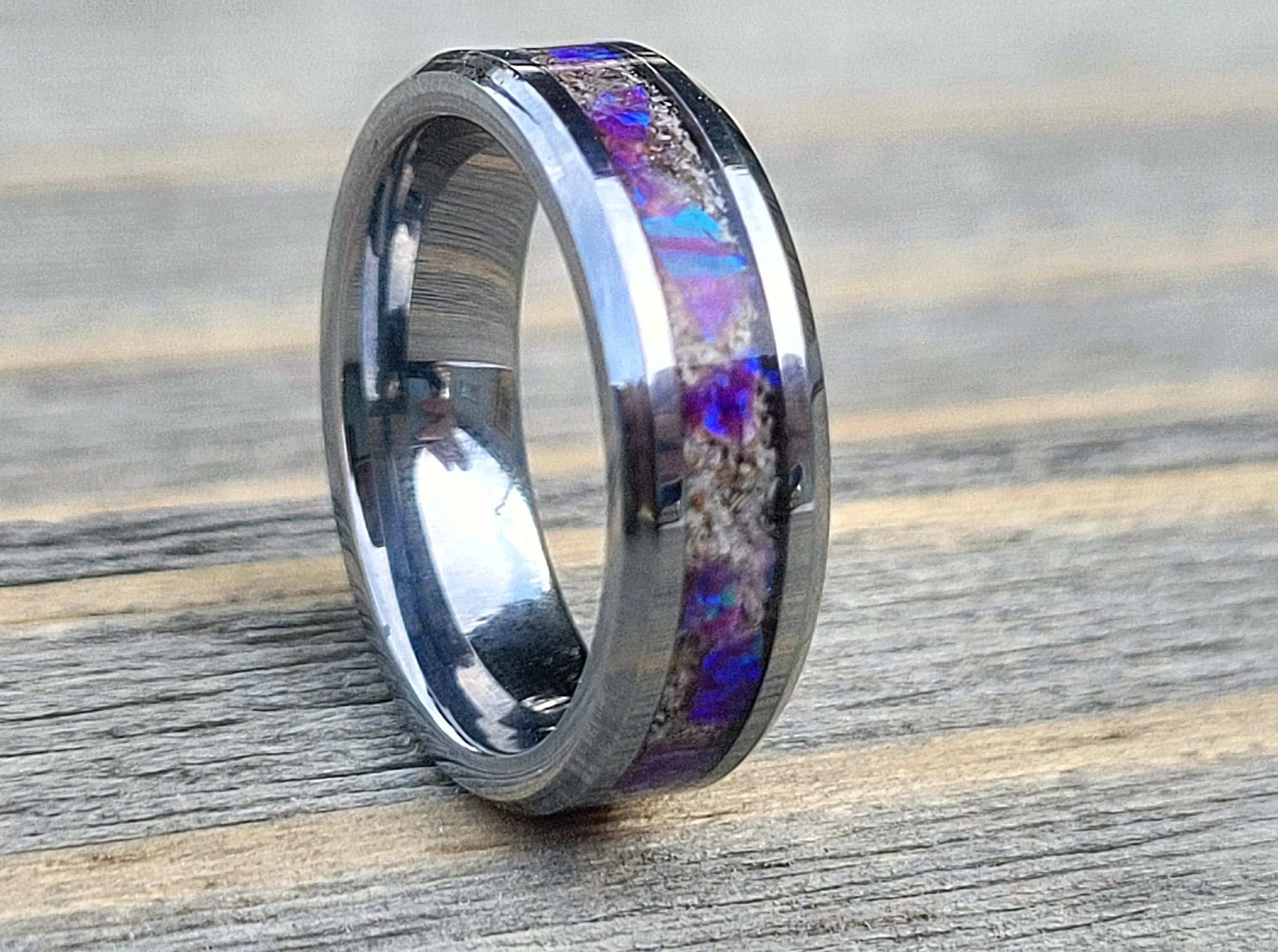 Amethyst Opal & ashes ring on wood surface, memorial jewelry remembrance, cremation ashes keepsake ring.