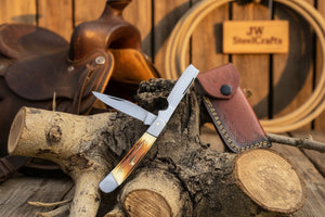 Razor Trapper Knife with Burned Bone Handle and Steel Bolsters detail view by JW SteelCrafts