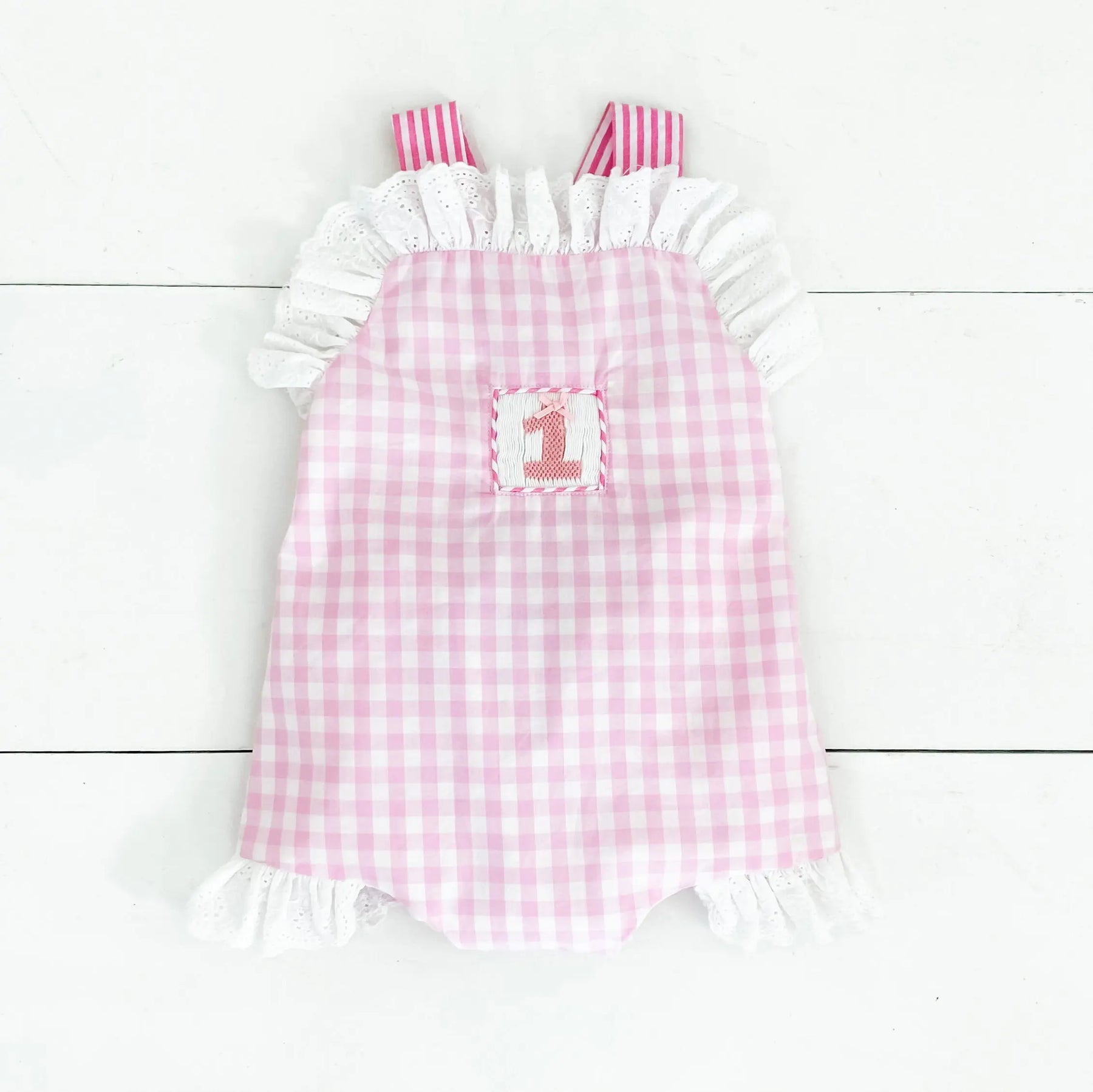 Baby Girl Smocked First Birthday Bubble by Seven Lantern Lane, children's boutique clothing main product photo