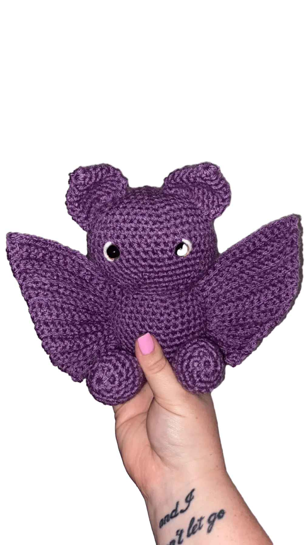 Crochet Purple Bat Plush Toy, Handmade Amigurumi by Main Street Collective. Cute handmade bat with wings, held in hand.