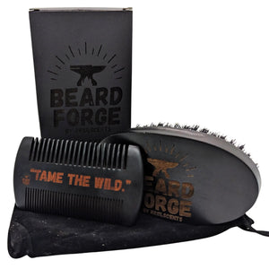 Beard grooming set: black box, wooden comb with "Tame the Wild," and brush in a velvet bag.