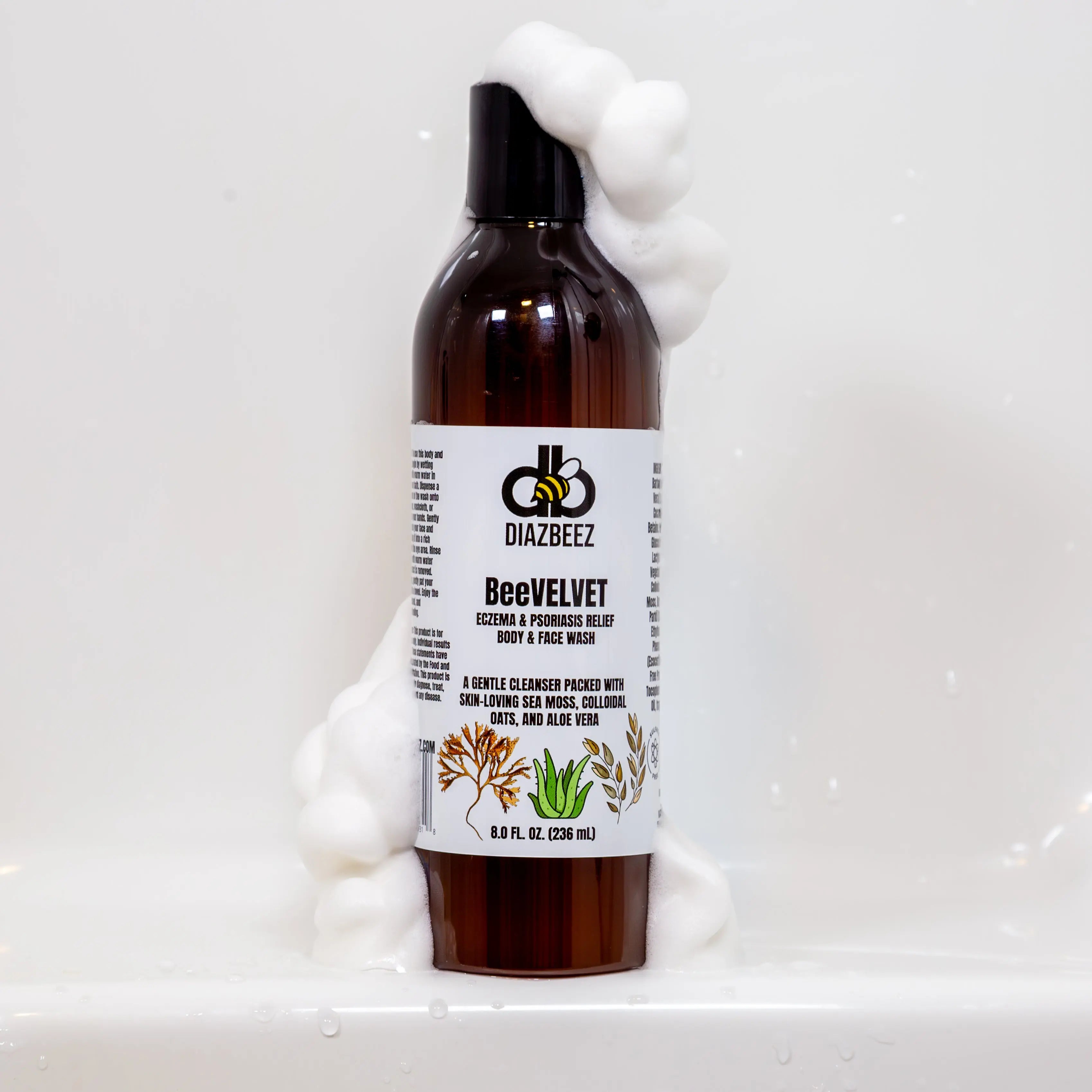 BeeVELVET eczema and psoriasis relief body wash by Diazbeez in brown bottle with foam.