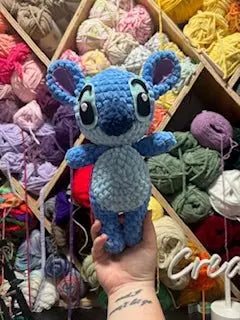 Crochet Stitch Amigurumi: Handmade Blue Alien from Lilo & Stitch. Adorable plush toy by Main Street Collective.