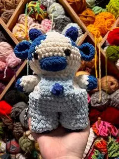 Blueberry Cow Crochet Plush: Handmade blue and white stuffed cow with overalls. Adorable crocheted toy from Main Street Collective.