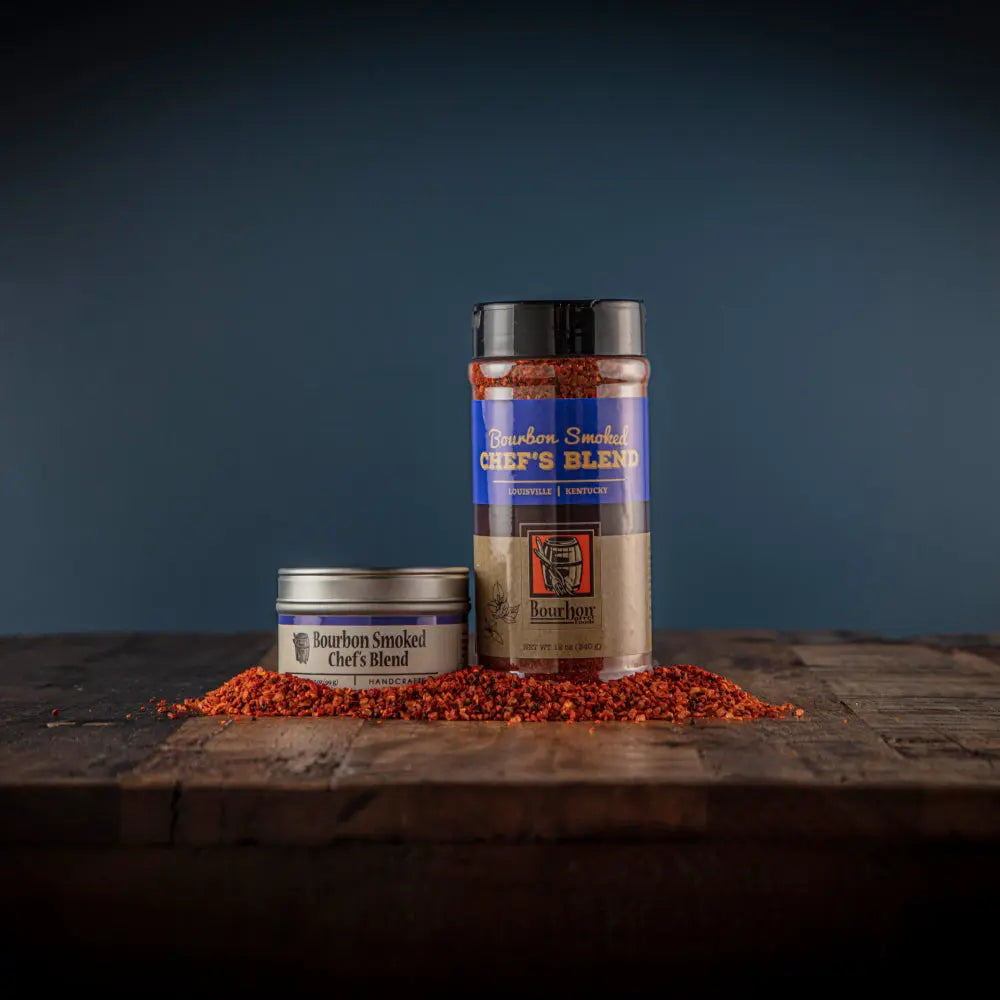 Bourbon Smoked Chef's Blend seasoning in tin and shaker on wood