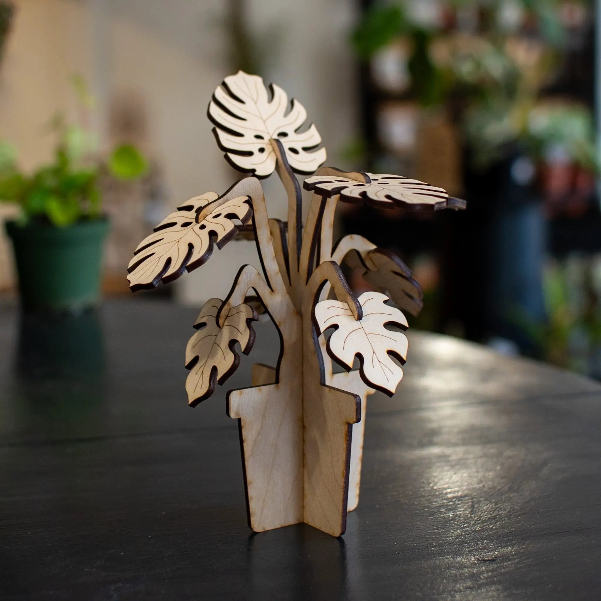 3D wooden monstera plant model in a pot