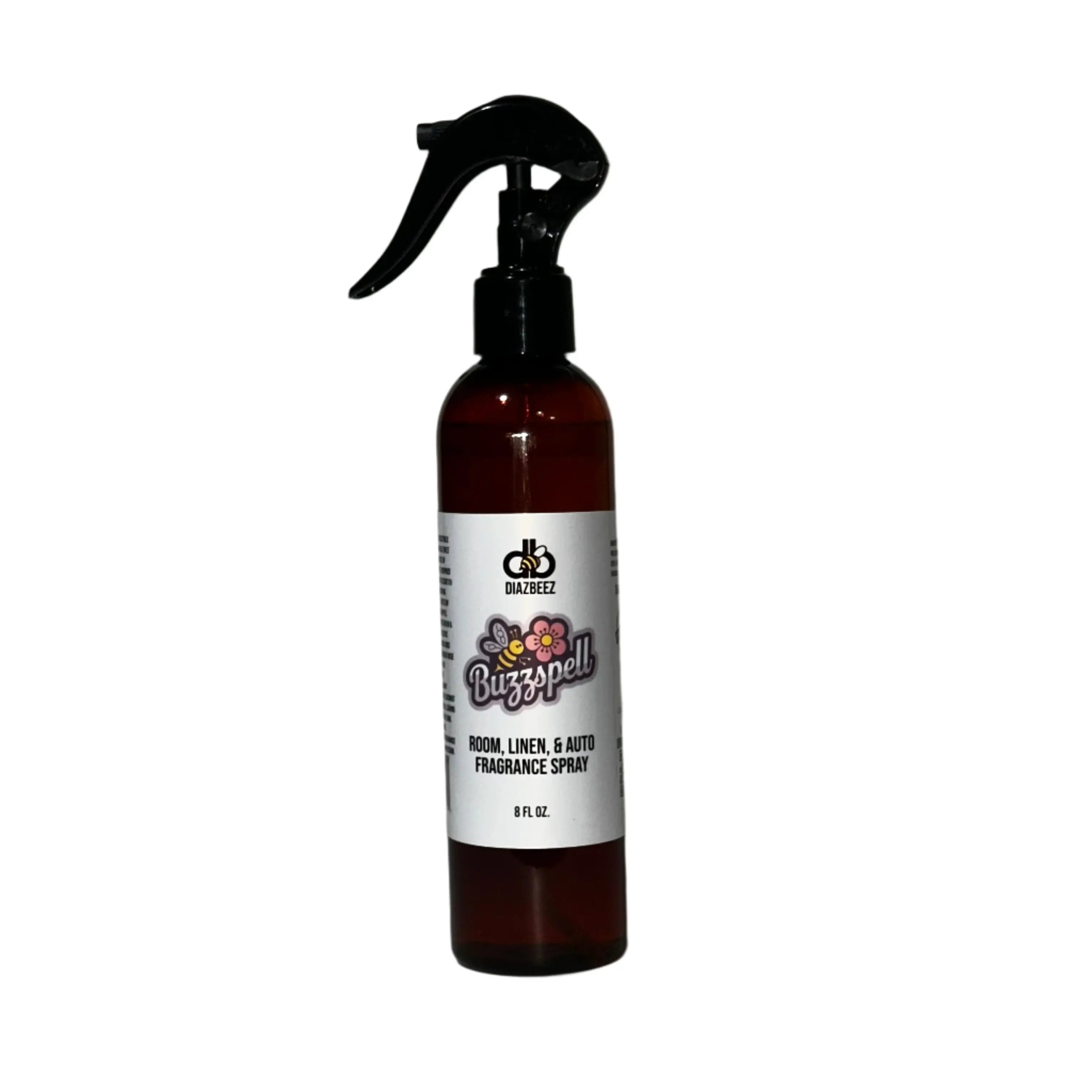 Brown Buzzspell fragrance spray bottle with black nozzle and white label with bee and flower design; 8 fl oz