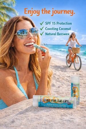 Woman applying Lube for the Lips SPF 15 coconut lip balm on a beach.