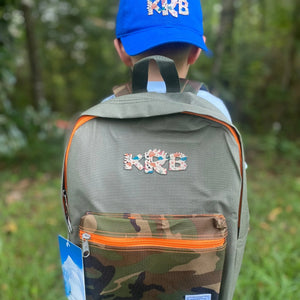 Camo Kids Backpack with Custom Dinosaur Initial Patch by Poor Hog Customs, handmade leather goods main product photo