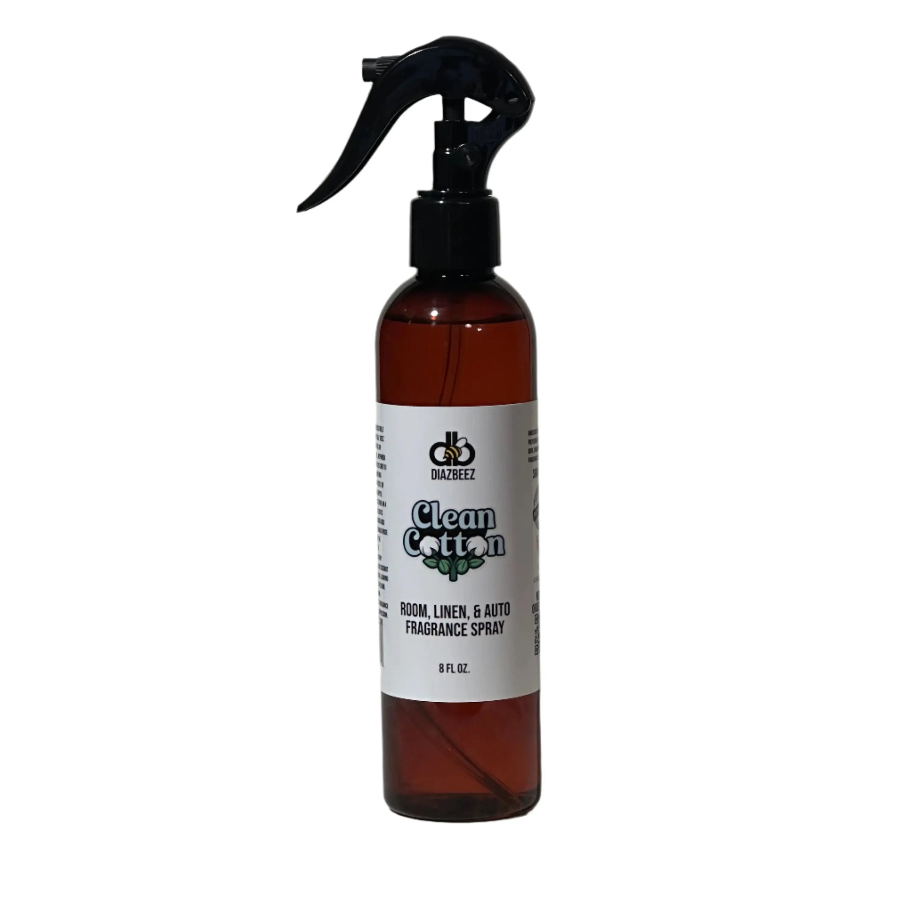 Clean Cotton Room, Linen, and Auto Fragrance Spray in a brown bottle with black spray nozzle. White label with text and logo.