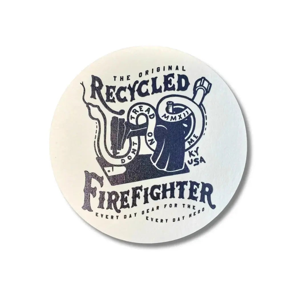 Round coaster with navy blue firefighter emblem and text MMXII KY USA.