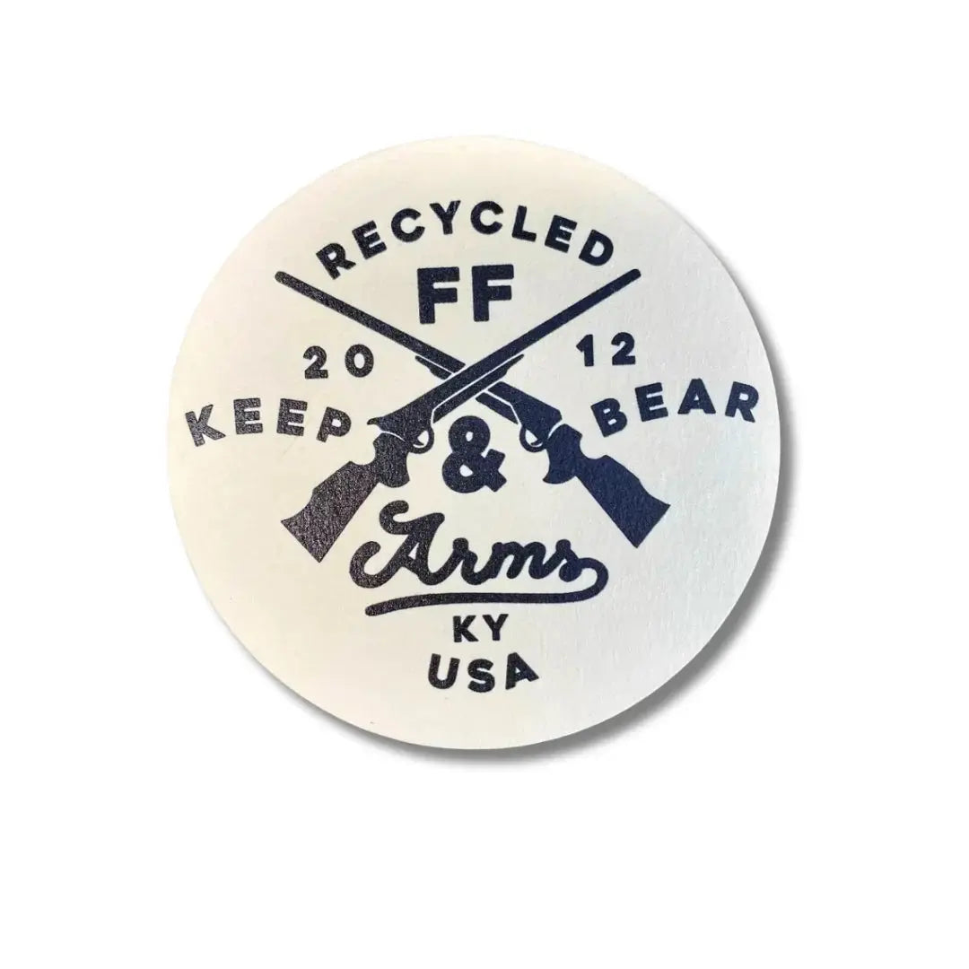 Circular coaster with crossed revolvers, "RECYCLED FF", "KEEP 20 12 BEAR", and "Arms KY USA" text.