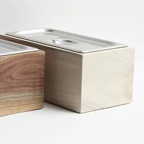 Countertop compost bin made of walnut wood and stainless steel, rectangular shape.