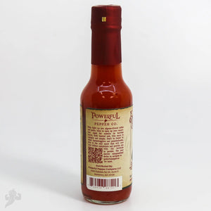 Powerful Pepper Co. barrel-aged hot sauce in a clear glass bottle with a red cap.