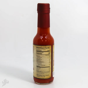 Dr. Gleaton's Chili Elixir hot sauce bottle with nutrition facts label.