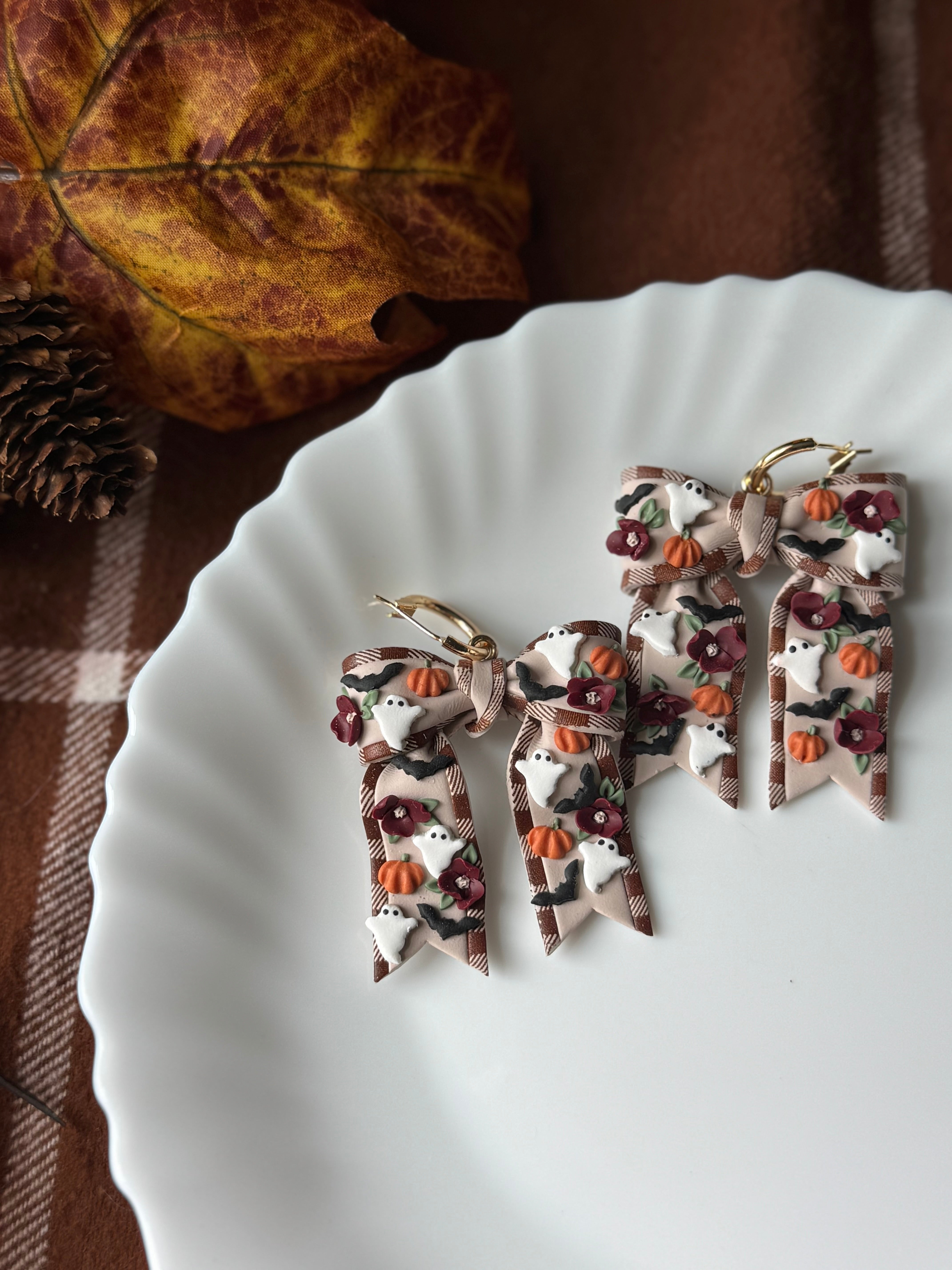 Haunted Harvest Bows handmade polymer clay earrings by Shop Something Earthy — view 1 of 2