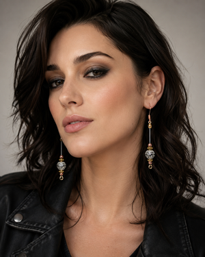 Woman wearing elegant earrings with a neutral background