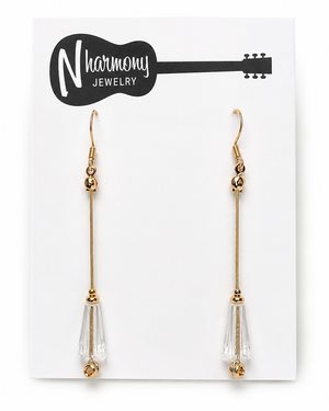 Gold and clear teardrop earrings on a N'Harmony Jewelry card.