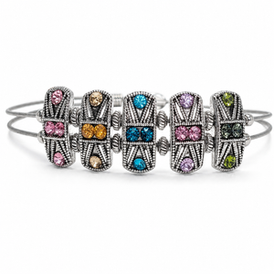 Set of silver bracelets with colorful gemstones on a white background