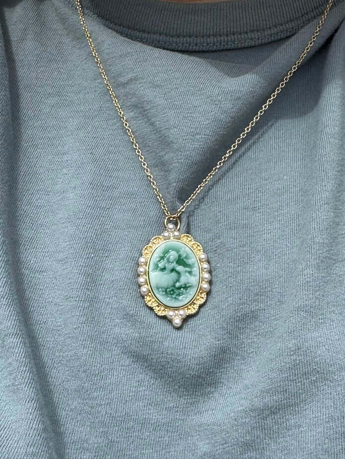 Cameo Necklace: Vintage Style Jewelry, Oval Pendant with Pearl Detail.