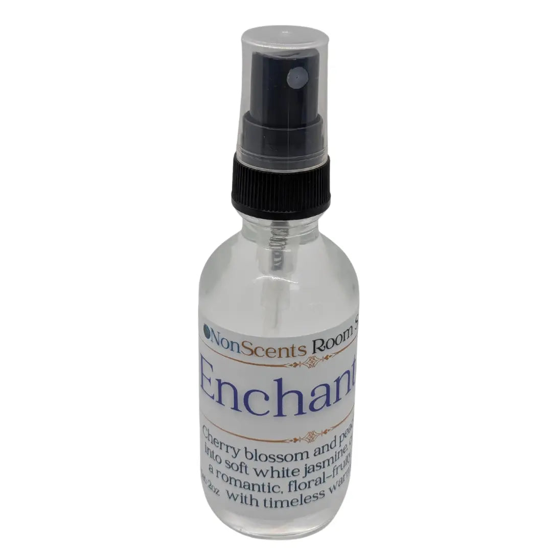 Enchanted Room Spray by NonScents: Clear bottle with black spray nozzle and floral scent label.