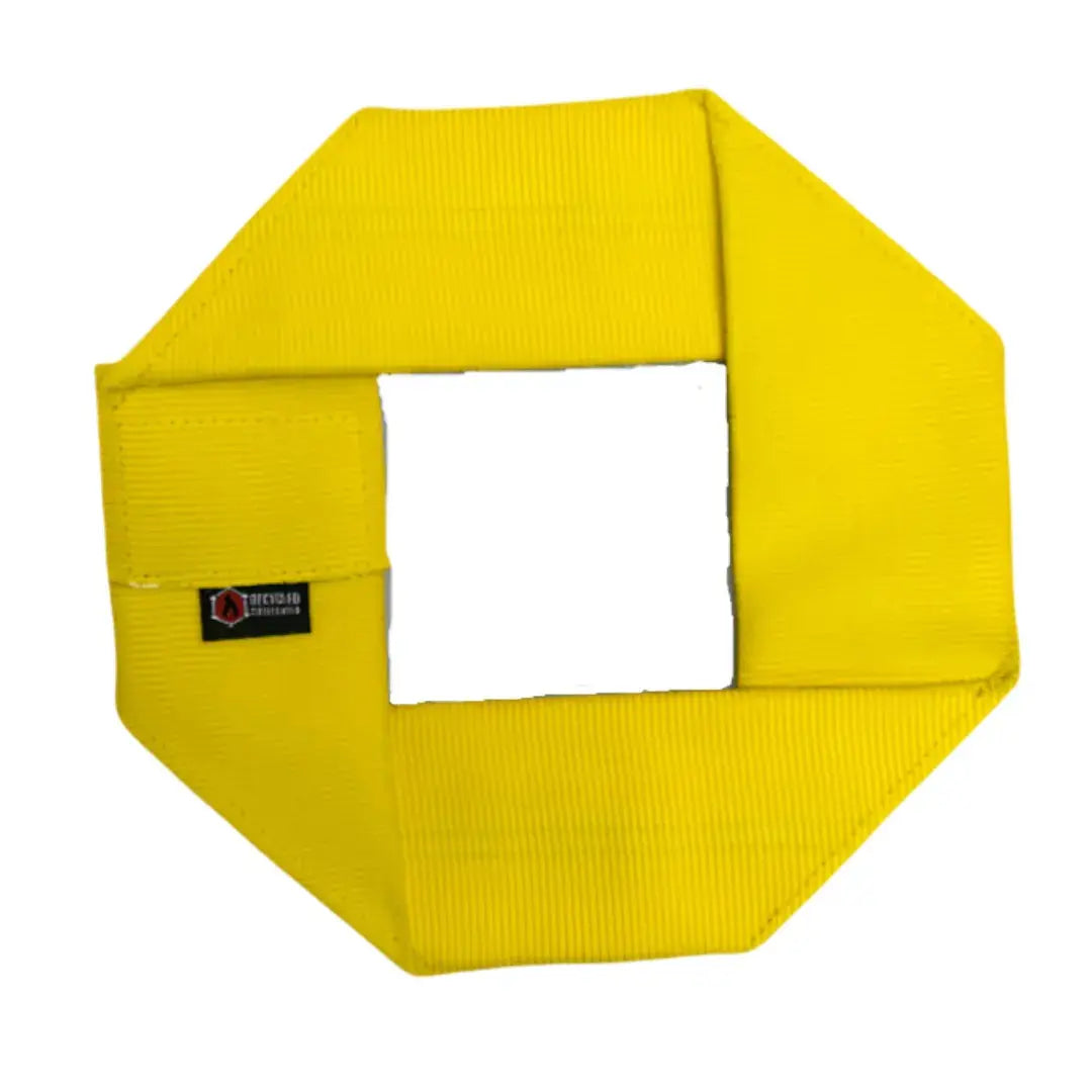 Yellow octagon fire hose dog frisbee with a white square cutout in the center.