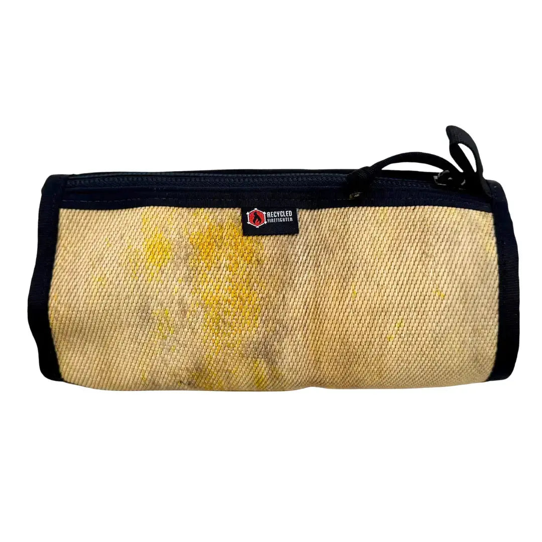 Tan fire hose dopp kit with black trim and zipper.