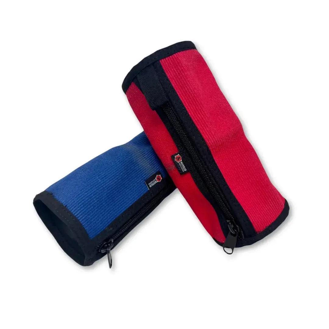 Red and blue fire hose toiletry bags with zippered closures