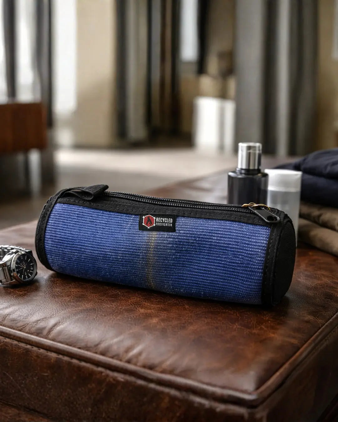 Blue fire hose toiletry bag with black zipper.