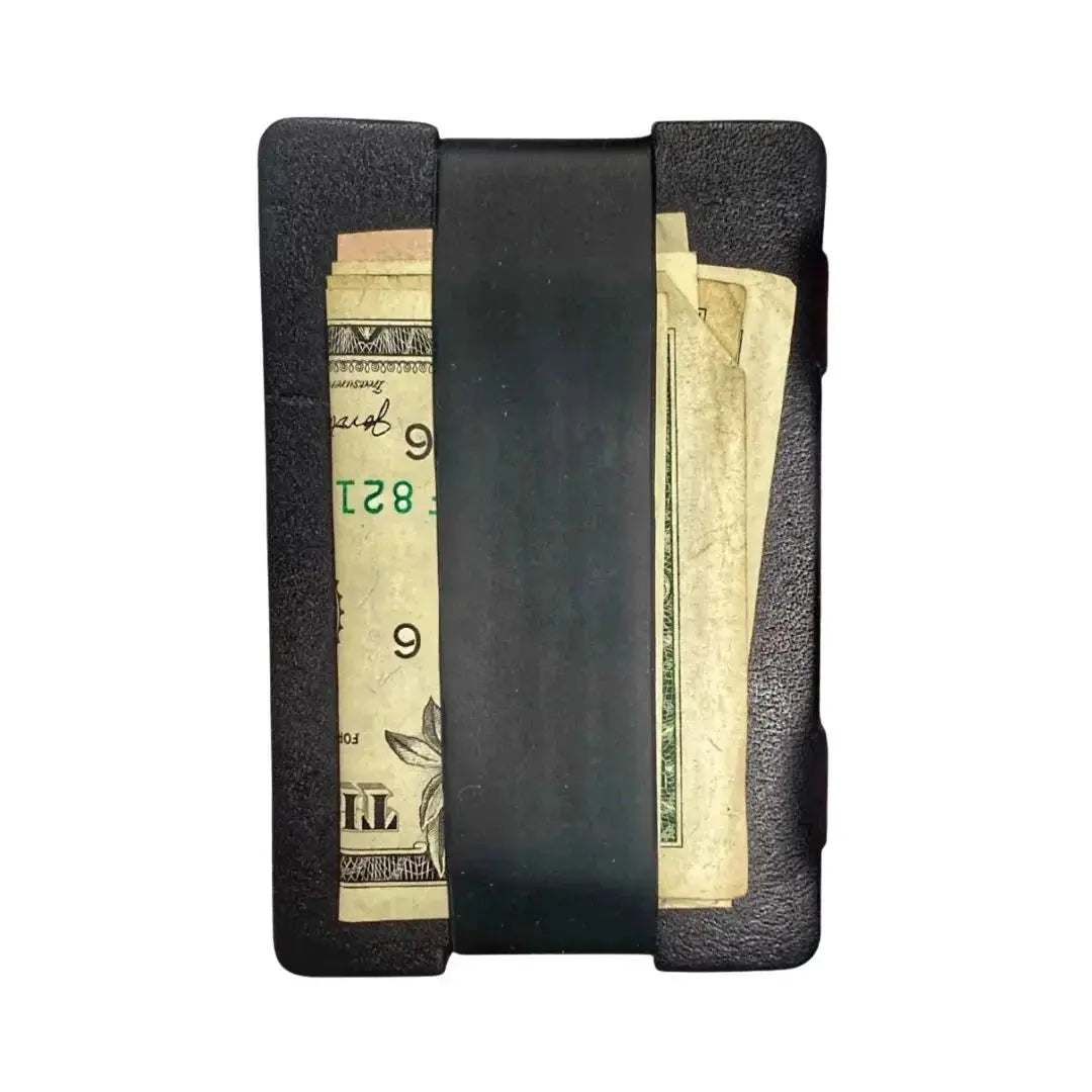 Full grain leather card wallet with silicone cash strap holding bills