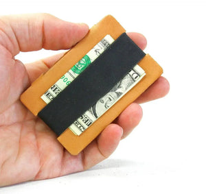 Full grain leather card wallet with silicone money clip holding cash