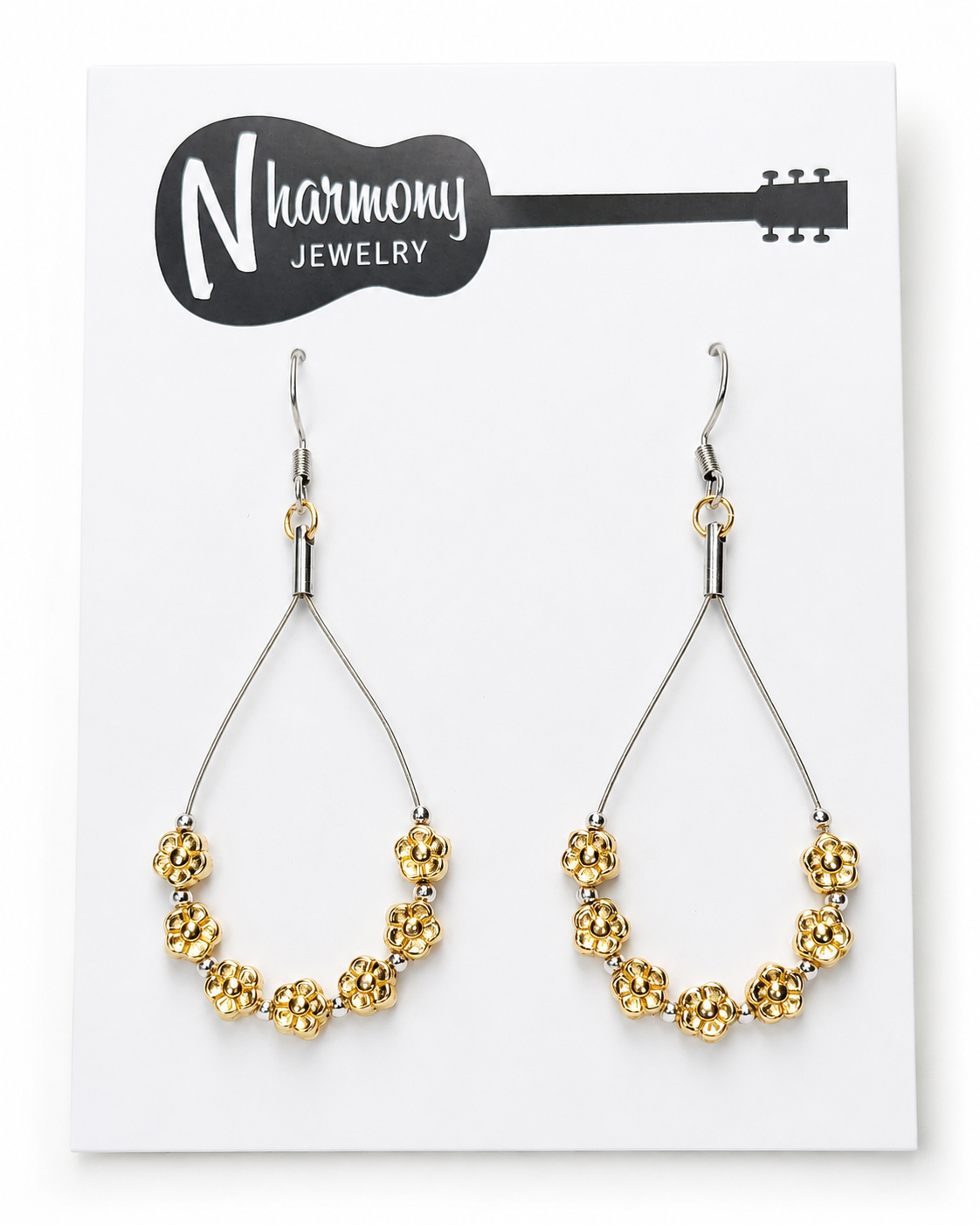 Gold beaded earrings on a NHarmony Jewelry card